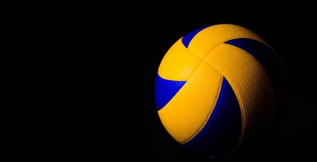 Volleyball ball on black background.