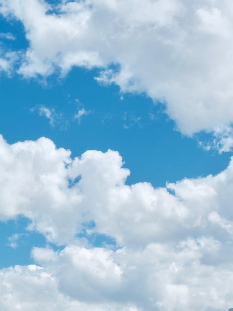 Volumetric white clouds on cyan blue sky Positive abstract background backdrop