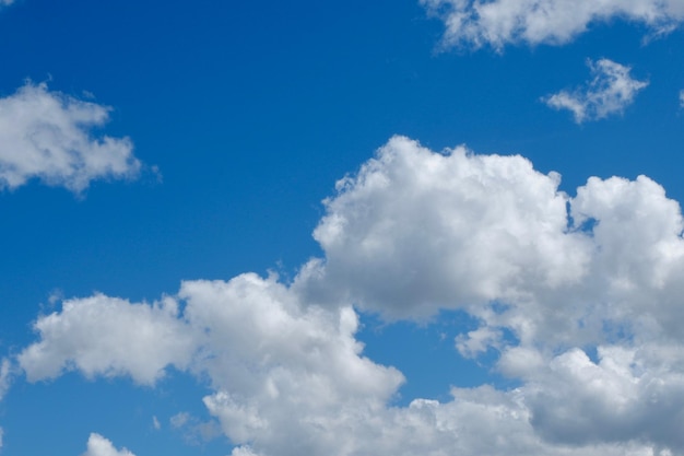 Voluminous white cloudscape on vivid blue sky