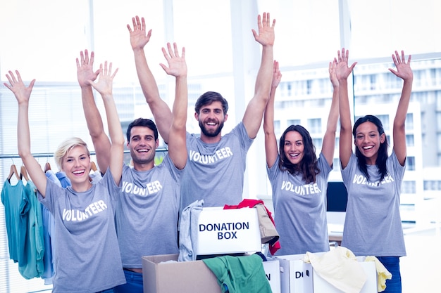 Volunteers raising their hands