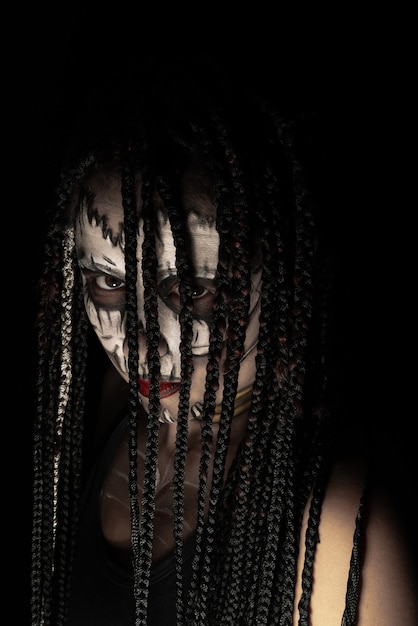 Voodoo queen, portrait of a supernatural entity Voodoo queen, artistic makeup, black background, Low Key portrait, selective focus.