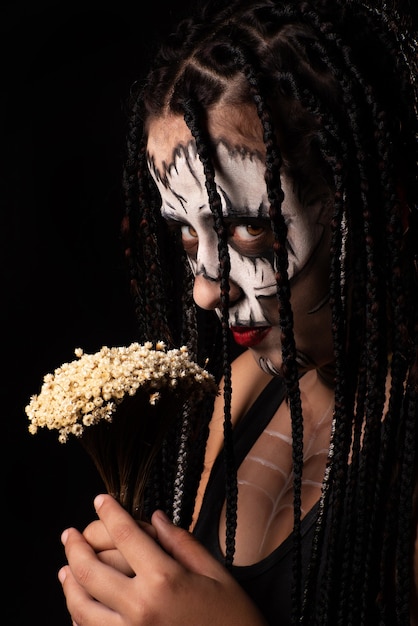 Voodoo queen, portrait of a supernatural entity Voodoo queen, artistic makeup, black background, Low Key portrait, selective focus.