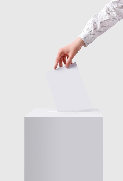 The voter throws the ballot into the ballot box The concept of democracy Voting concept