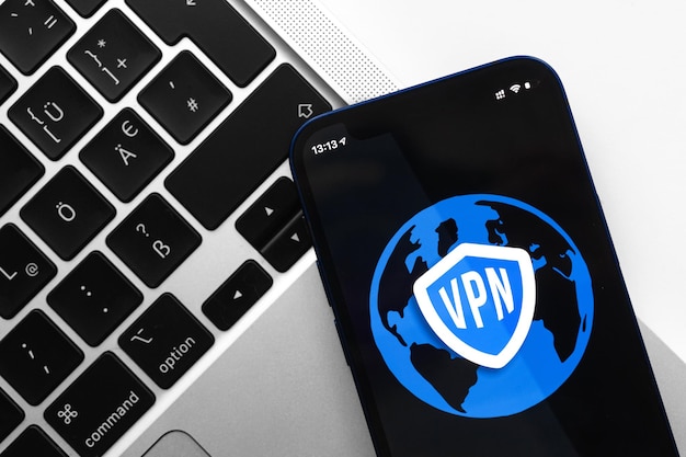 VPN anonymous safe and secure internet access on mobile phone Desktop with laptop technology background photo