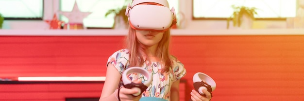 Vr game virtual reality kid girl gamer playing on futuristic simulation video game in 3d glasses