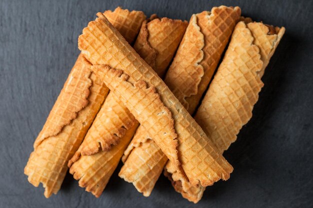 Wafer rolls with condensed milk thin and crispy waffle selective focus