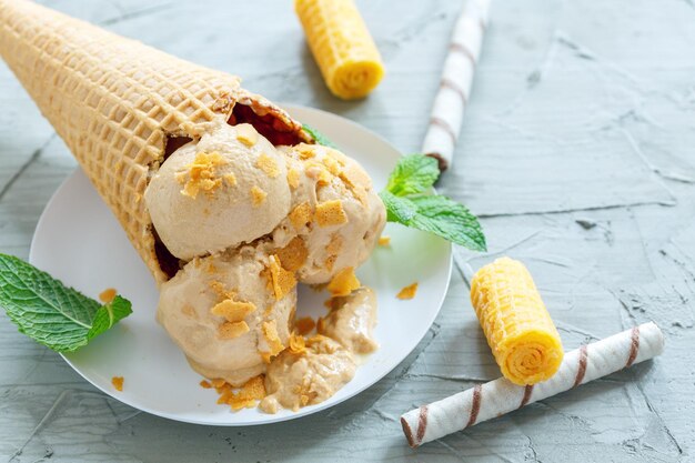 Waffle cone with caramel ice cream