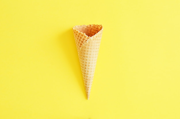 waffle cone on yellow background