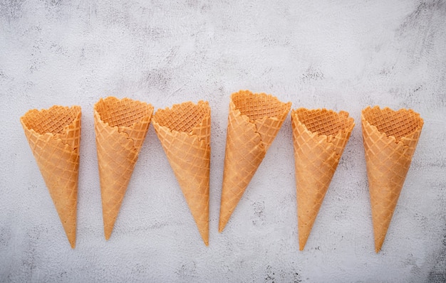 Waffle ice cream cones on a concrete table