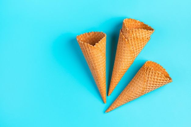 Waffle ice cream cups on a blue background