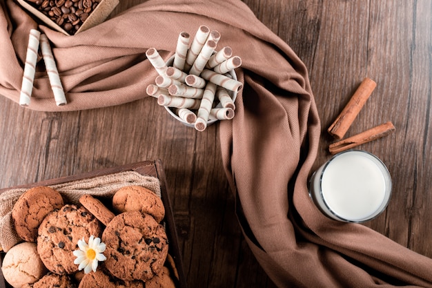 Waffle sticks, cookies and a glass of milk