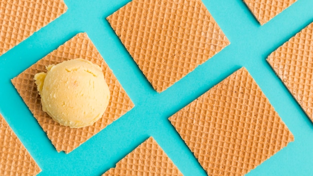 Waffles arranged on blue background