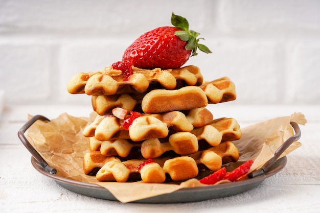 Waffles with berries on the plate