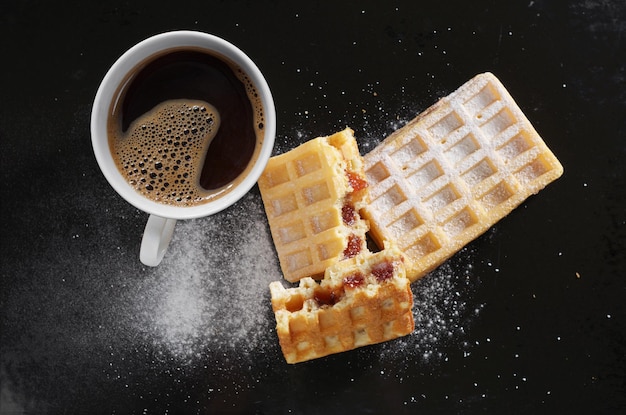 Waffles with jam and coffee