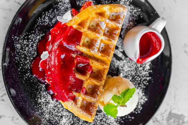 Waffles with strawberry and Vanilla Ice Cream 