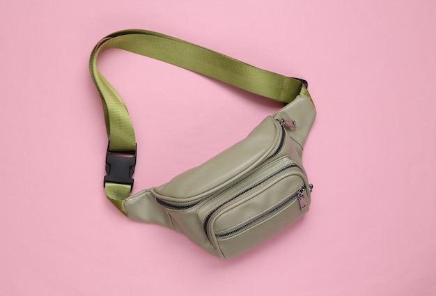 Waist banana bag on a pink background Top view