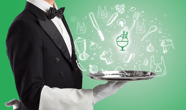 Photo waiter holding silver tray with food icons above