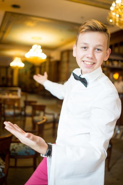 Waiter in restaurant saying welcome