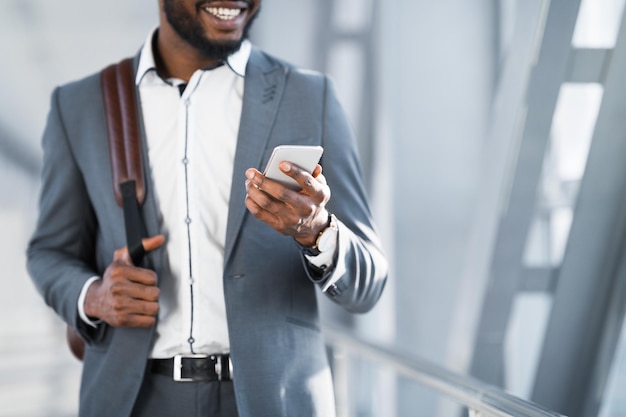 Waiting for Boarding Businessman Using Phone in Airport Terminal