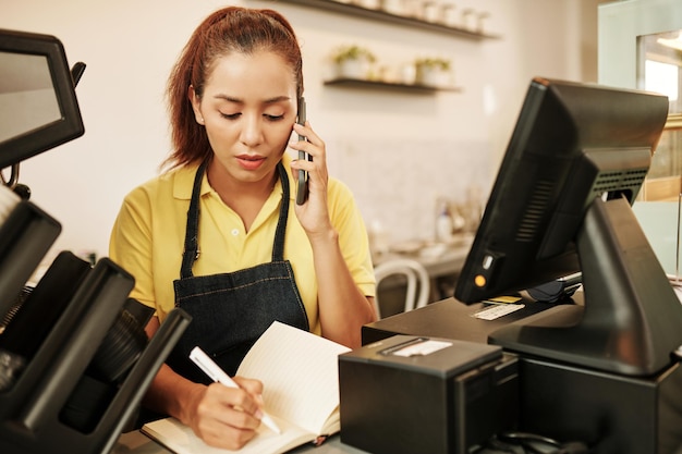 Waitress Accepting Order via Phone Call