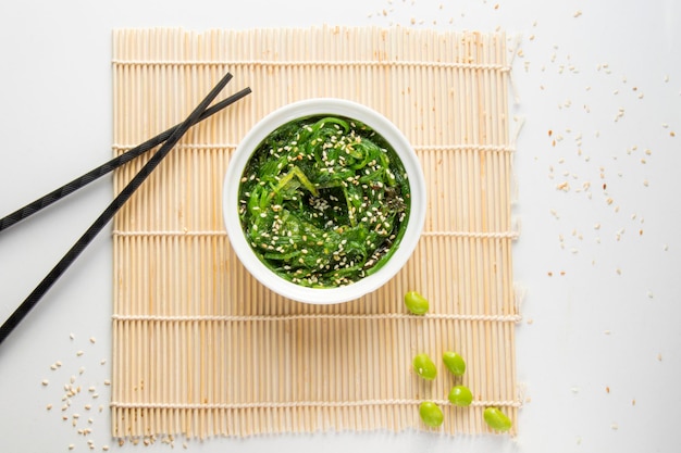 Wakame in the white bowl and chopsticks