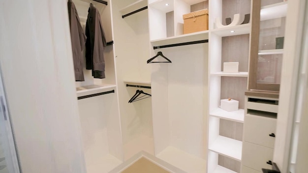 a walk in closet with a white shelf that says  walk - in closet