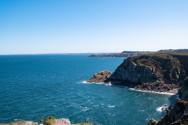 Walk on the GR34 in Brittany with far away La Latte fort