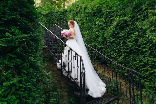 Walking bride in a wedding dress to the ceremony View from the