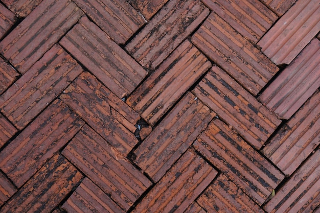 walkway is paved with brown bricks.