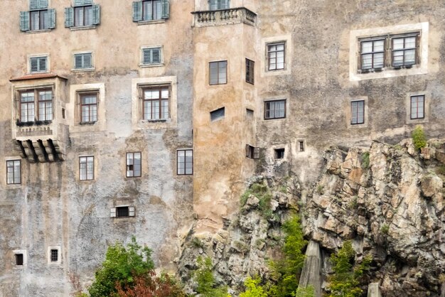 Wall of an ancient castle with windows