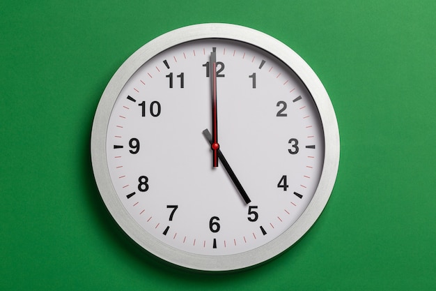 wall clock show five o'clock