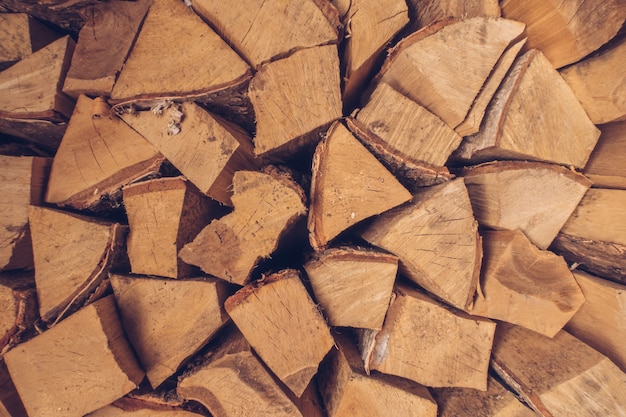 Wall of firewood. Prepared pile of dry chopped firewood logs stock photography