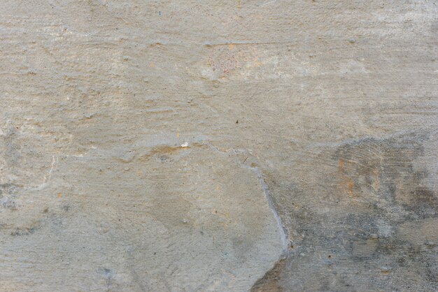 Wall fragment with scratches and cracks