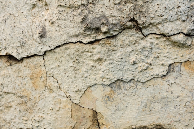 Wall fragment with scratches and cracks