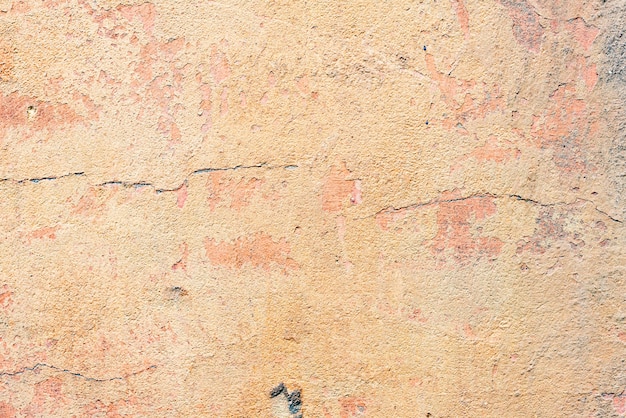 Wall fragment with scratches and cracks