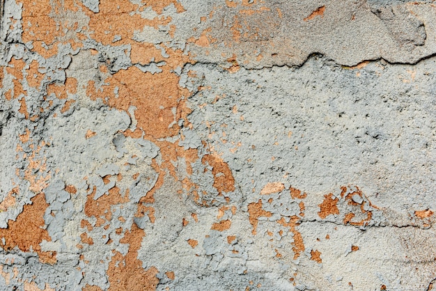 Wall fragment with scratches and cracks