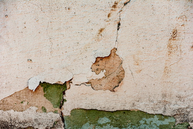 Wall fragment with scratches and cracks