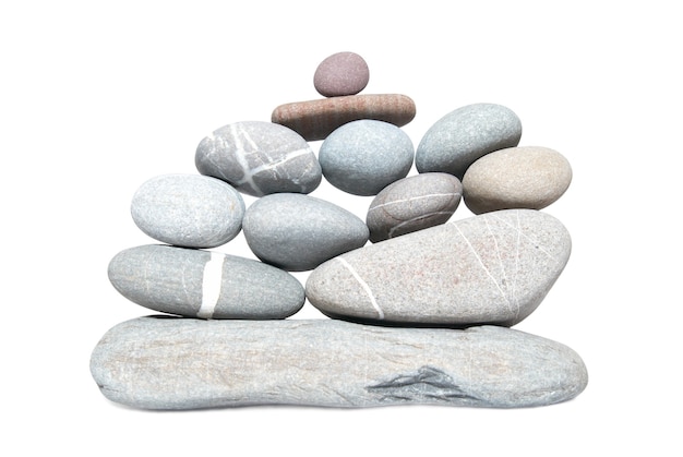 Wall of gray pebbles isolated on white