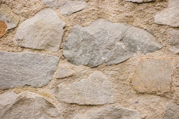 The wall is beige Decorative brick The texture of the stone Abstract background