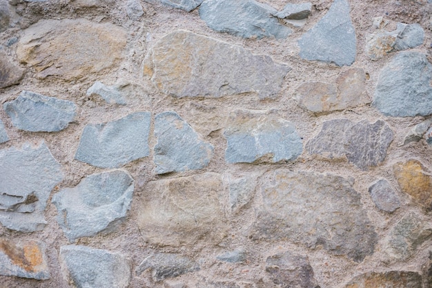 The wall is beige Decorative brick The texture of the stone Abstract background