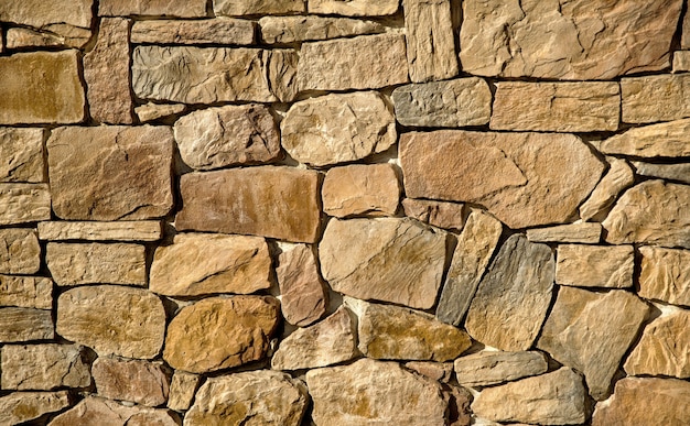 The wall is lined with large brown stones and occupies the entire frame