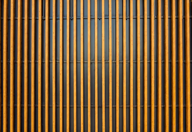 The wall is made of white wooden vertical slats.