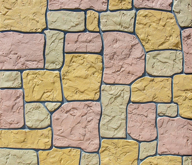 Wall made of colored stones as background