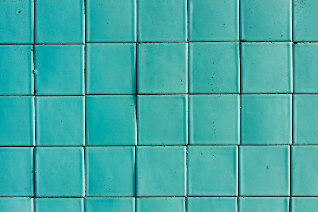 Wall of old square tiles blue. background for design. High quality photo