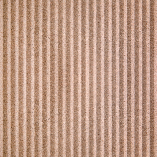 Wall paper design Brown corrugated sheet of cardboard as background