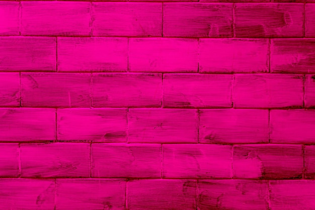 Wall with bricks textured and colored in pink