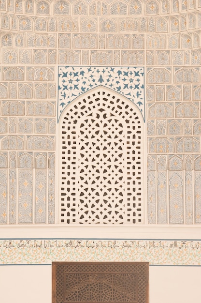 Wall with white mosaics and traditional ornament Architecture of medieval Central Asia