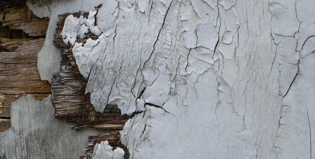 A wall with white paint on it