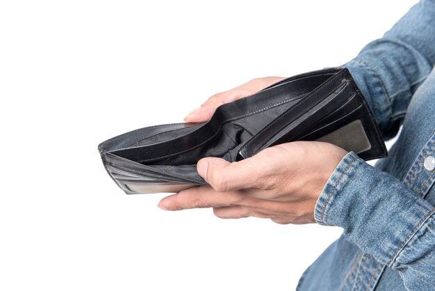 Wallet black which is many US dollars of money in the hands of young which wear jeans.