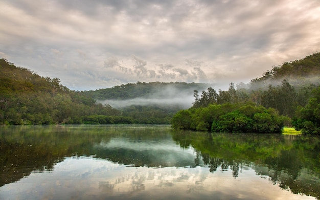 Wallpaper of reflection of mountains in clear lake water